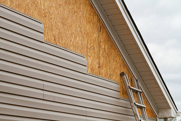 Professional Vinyl Siding technician working in Walpole, MA